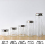 Alessi AKK37 GIROTONDO Køkkenkrukke i glas med påtryk og forseglet låg i rustfrit stål, L 21,6 cm, H 10,5 cm Fødevarekasser Naty Shop