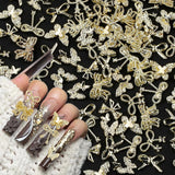 50Stück 3D Guld Sløjfe Nail Charms Butterfly Nail Art Charms Legierung Bogen Nagel Charms Nägel Zubehör Schleife Nagelschmuck Metall Schleifen Schmetterling Nageldesign Nagelanhänger Nailart Strasssteine