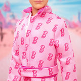 Barbie The Movie - Ken-Sammelpuppe, Ryan Gosling som Ken i rosafarbenem Overall mit "B"-Aufdruck, hvid sneakern og bunten Inlineskates, JCP80