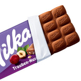 Milka druer og hasselnødder – Alpine mælkechokolade med stykker af hasselnødder og rosiner – 90 g
