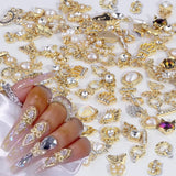 50 Stück Guld Nail Charms, Mix Styles Glitzersteine ​​Nägel Perle Legierung Nagel Steine ​​​​Blume Schmetterling Strasssteine ​​​​Nägel Herz Stern Nagel Charms DIY Nail Art Zubehör Frauen Nägel Deko