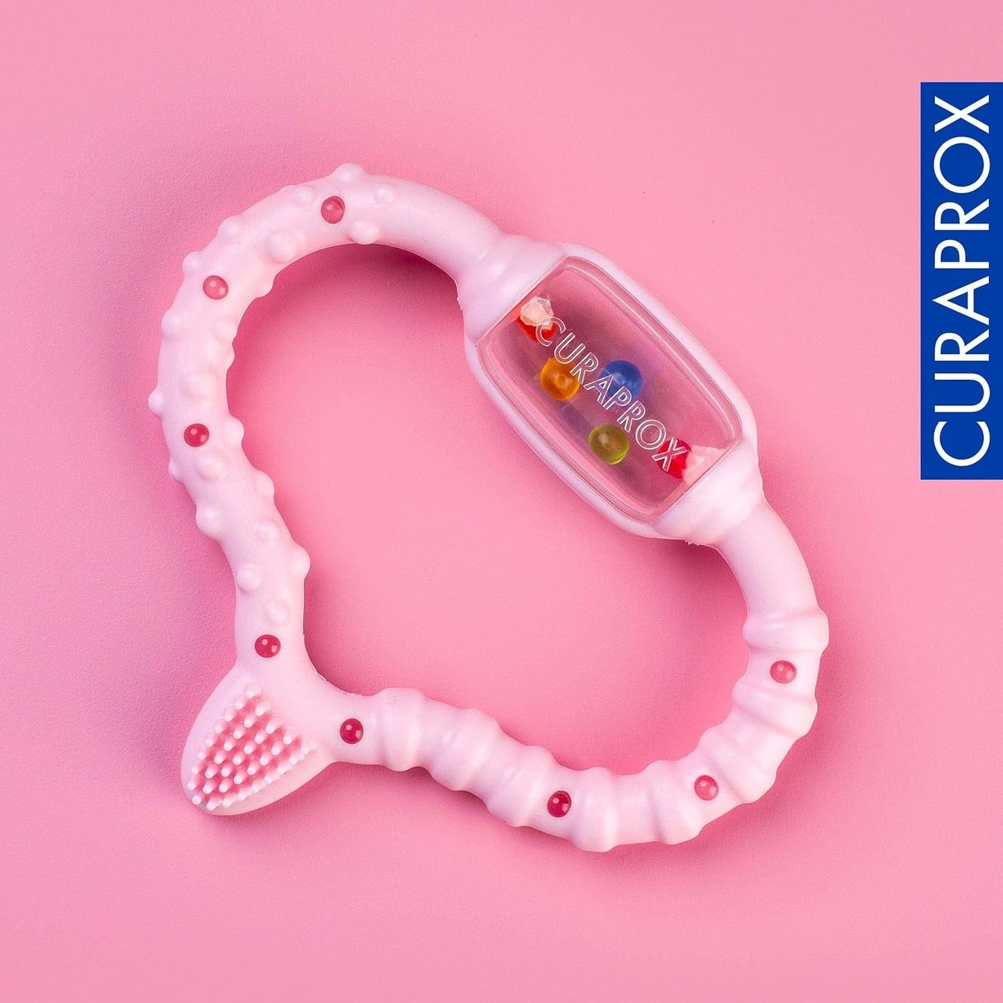 Curaprox babyring til tandfrembrud - Til små børn 0-24 måneder/Lindrer tandpine og fremmer motoriske færdigheder | BPA-fri, Lyserød, med træningstandbørste/Fremstillet i Schweiz
