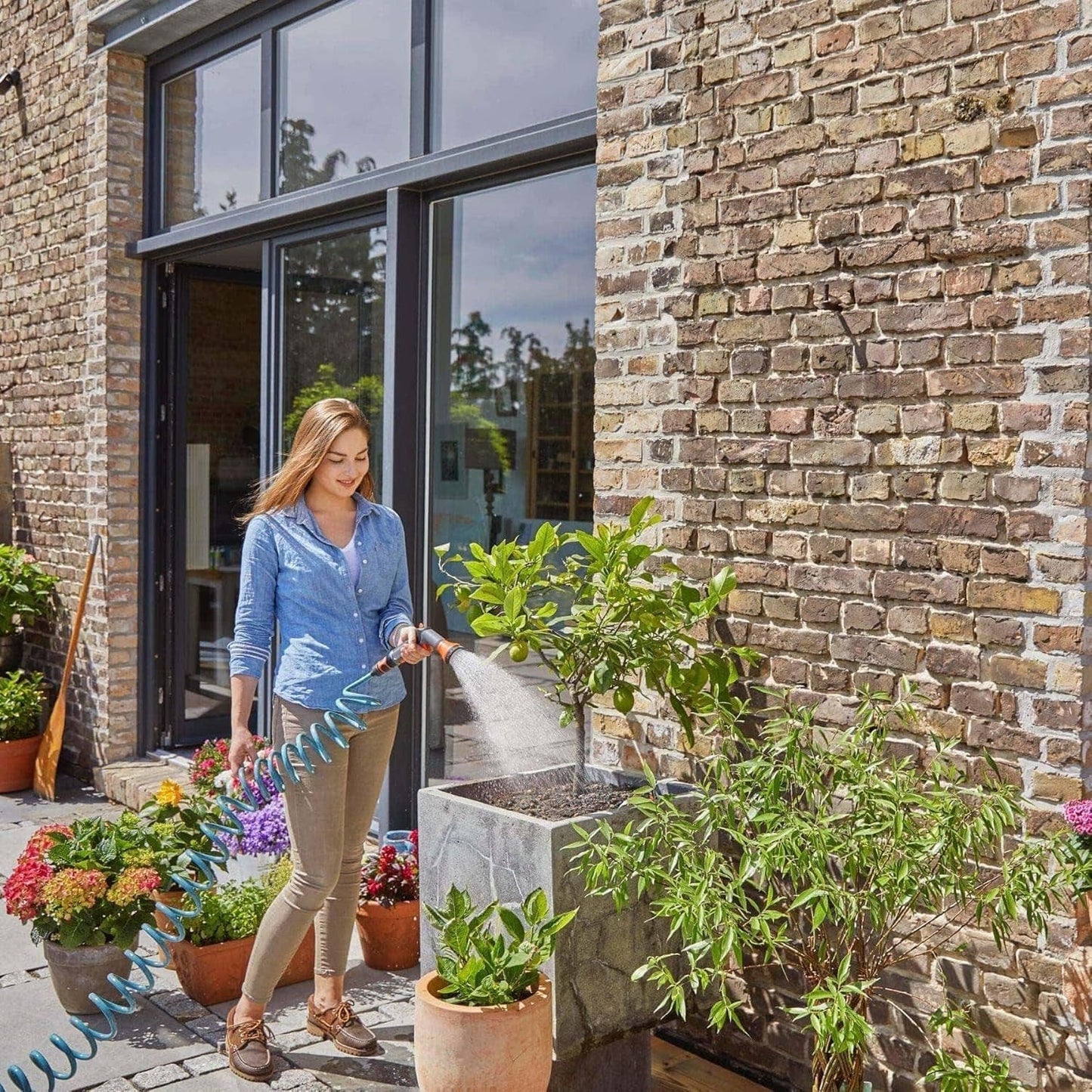 Gardena 4647-20 spiralslange komplet sæt, med automatisk slangetilbagetrækning, med sprøjtemundstykke og hanetilslutning (slangelængde: 10 m, slangediameter: 9 mm, sæt: ja)
