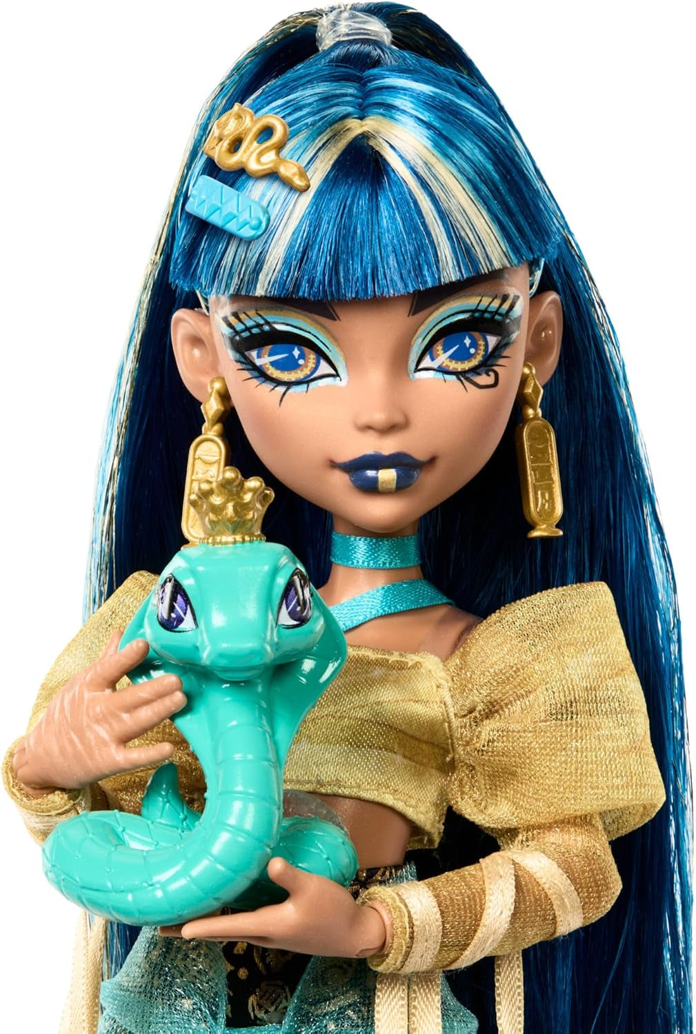 Monster High Cleo De Nile dukke i guldbluse og lagdelt nederdel, inkluderer Hissette cobra og tilbehør såsom en skoletaske, en snack og en rulle toiletpapir, HXH74
