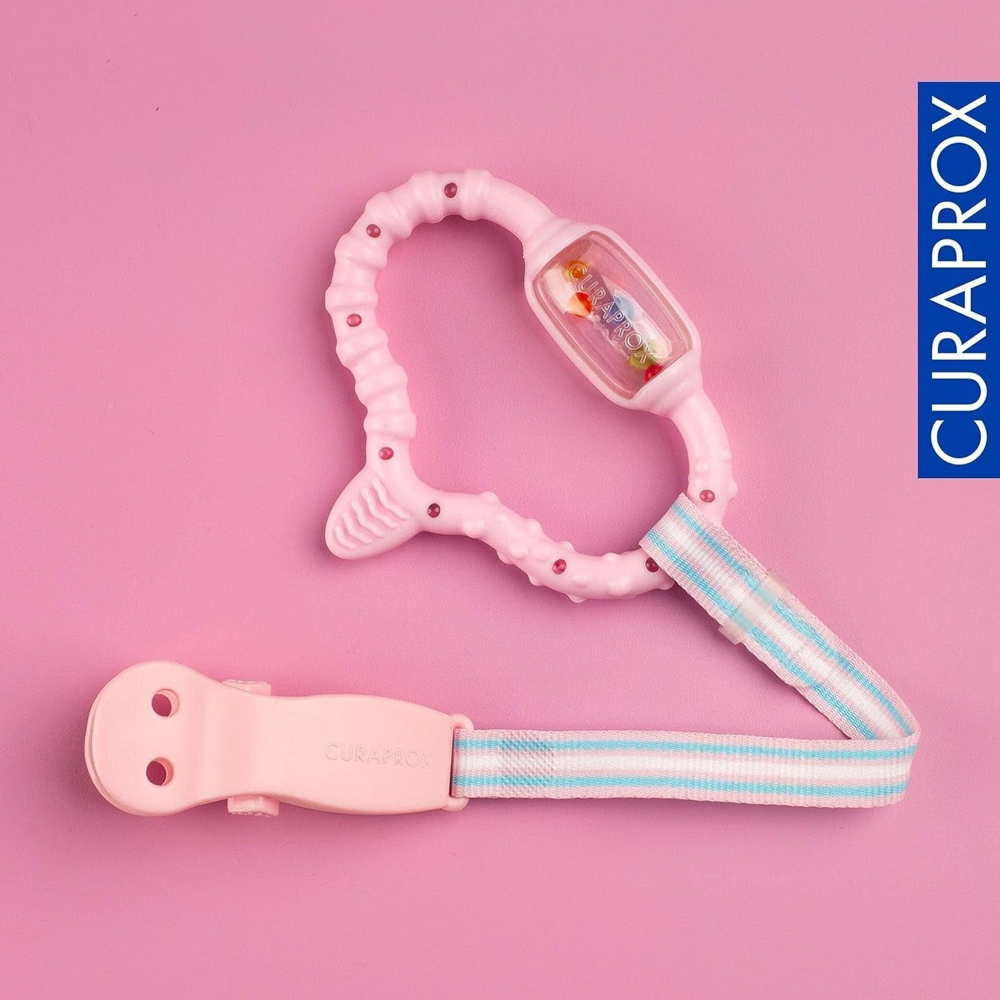 Curaprox babyring til tandfrembrud - Til små børn 0-24 måneder/Lindrer tandpine og fremmer motoriske færdigheder | BPA-fri, Lyserød, med træningstandbørste/Fremstillet i Schweiz
