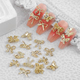 50Stück 3D Guld Sløjfe Nail Charms Butterfly Nail Art Charms Legierung Bogen Nagel Charms Nägel Zubehör Schleife Nagelschmuck Metall Schleifen Schmetterling Nageldesign Nagelanhänger Nailart Strasssteine