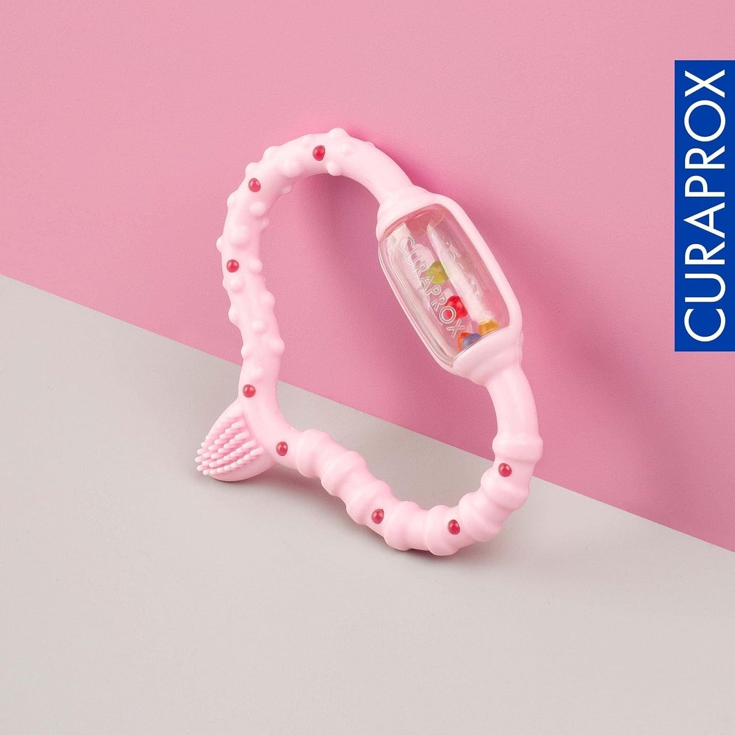 Curaprox babyring til tandfrembrud - Til små børn 0-24 måneder/Lindrer tandpine og fremmer motoriske færdigheder | BPA-fri, Lyserød, med træningstandbørste/Fremstillet i Schweiz