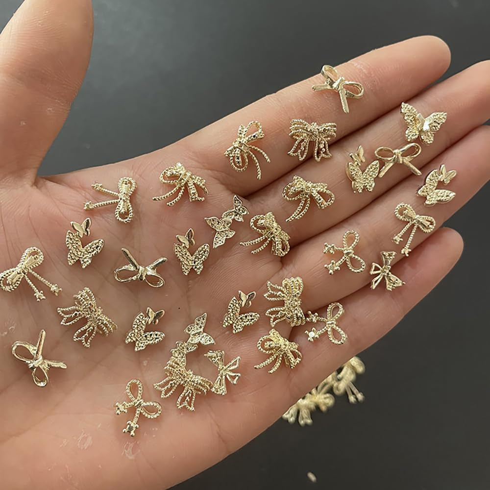 50Stück 3D Guld Sløjfe Nail Charms Butterfly Nail Art Charms Legierung Bogen Nagel Charms Nägel Zubehör Schleife Nagelschmuck Metall Schleifen Schmetterling Nageldesign Nagelanhänger Nailart Strasssteine